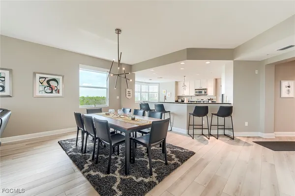 a view of a dining room with furniture and window