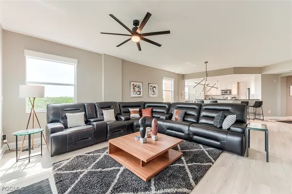 a living room with furniture and a window