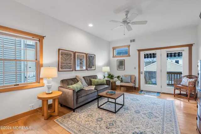 a living room with furniture and a rug