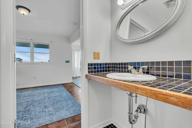 a bedroom with two beds and a window