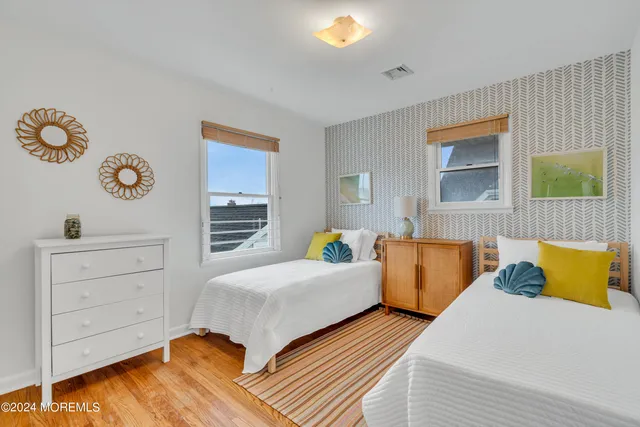 a bed room with a bed and a chair