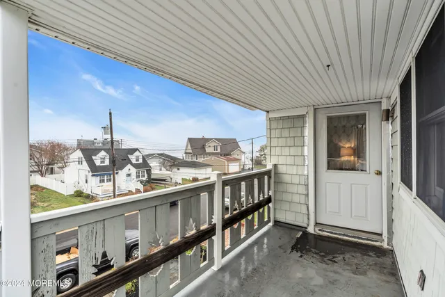 a view of a house with wooden fence