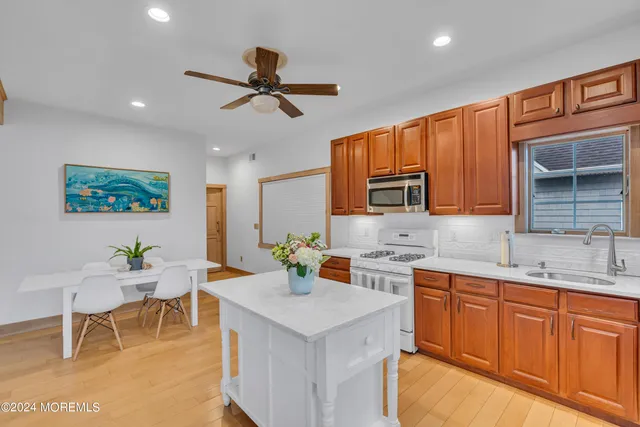 a bathroom with a sink a mirror and shower