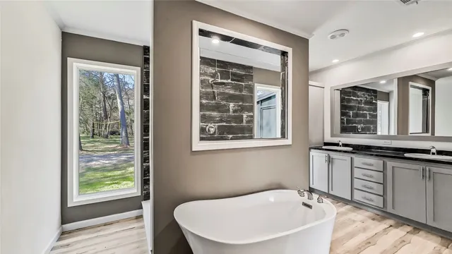 a bedroom with furniture and a window