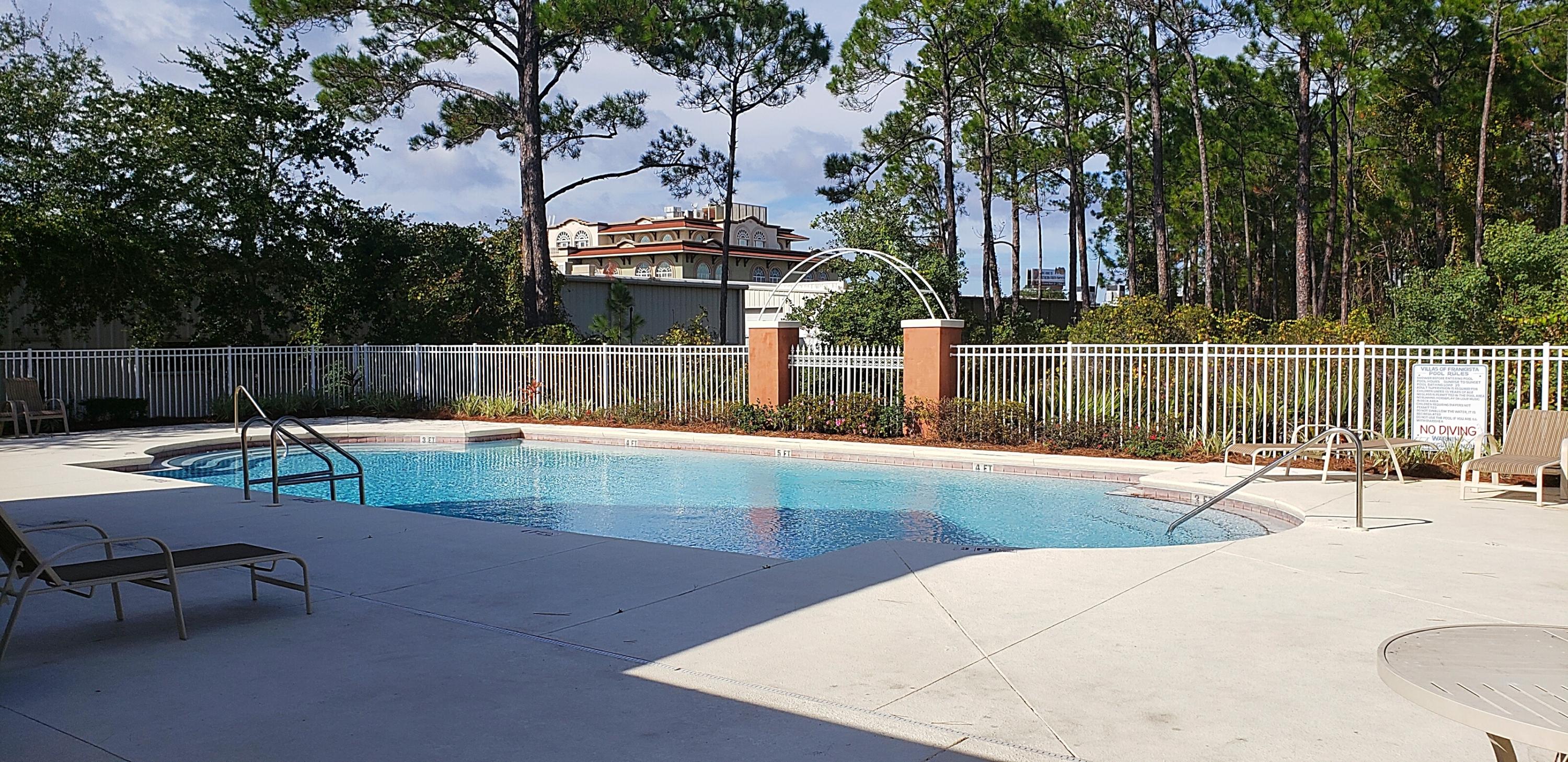 55 Shelley's Way Miramar Beach, FL 32550 - Photo 7 of 15 a view of a swimming pool with a lounge chair
