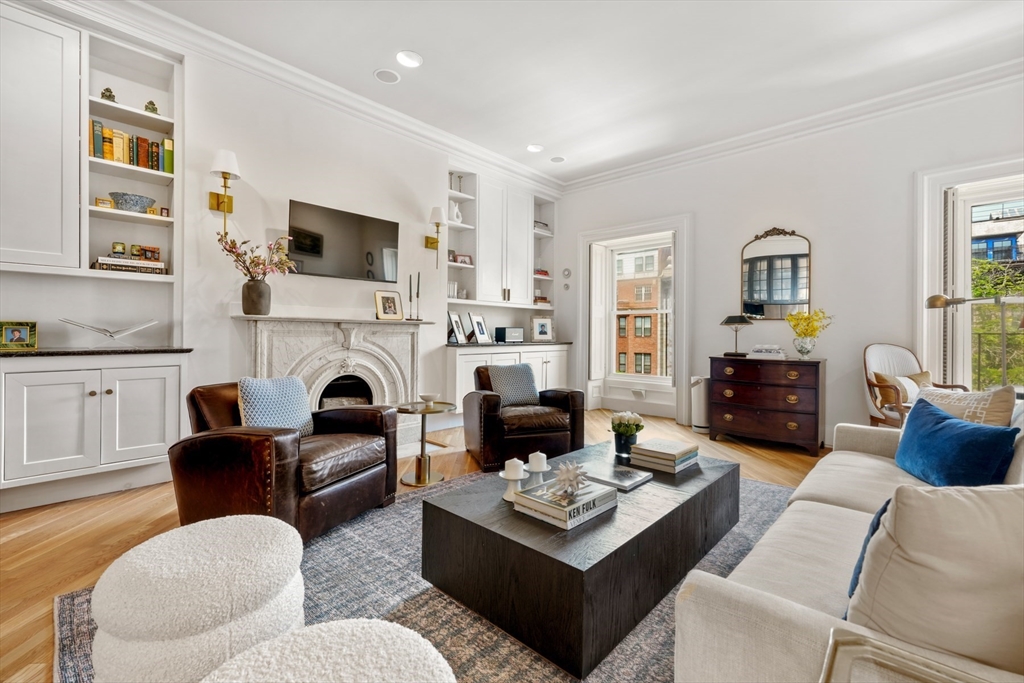 a living room with furniture fireplace and a flat screen tv
