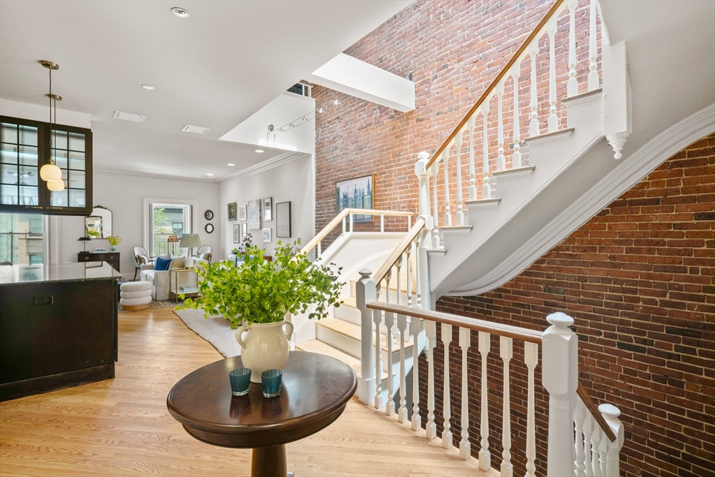 129 Beacon Street, Unit PH Boston, MA 02116 - Photo 11 of 40 a view of entryway and hall with wooden floor