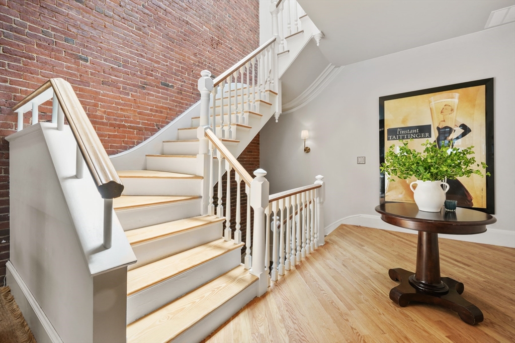 129 Beacon Street, Unit PH Boston, MA 02116 - Photo 12 of 40 a view of entryway with wooden floor and front door
