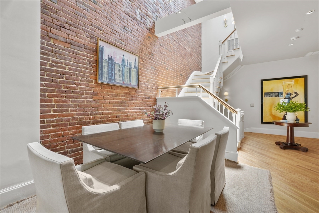 129 Beacon Street, Unit PH Boston, MA 02116 - Photo 13 of 40 a view of a livingroom with furniture and window