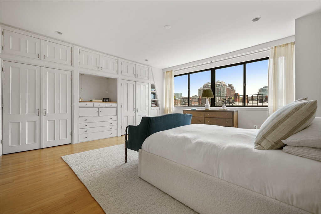 129 Beacon Street, Unit PH Boston, MA 02116 - Photo 16 of 40 a bedroom with a large bed and a large window