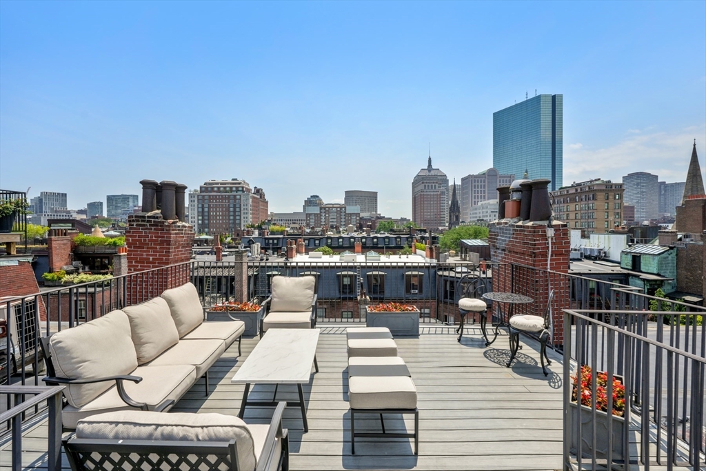 129 Beacon Street, Unit PH Boston, MA 02116 - Photo 25 of 40 a view of a city from a terrace