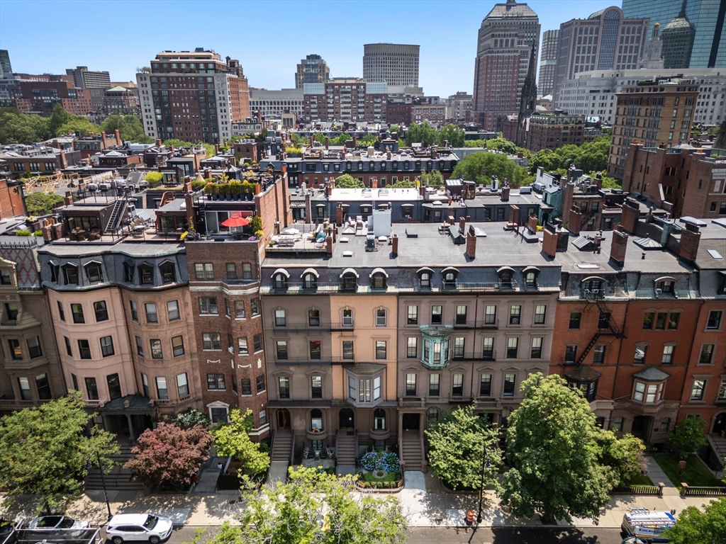 129 Beacon Street, Unit PH Boston, MA 02116 - Photo 30 of 40 a view of a city with tall buildings