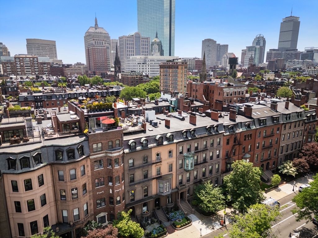 129 Beacon Street, Unit PH Boston, MA 02116 - Photo 31 of 40 a city view with tall buildings