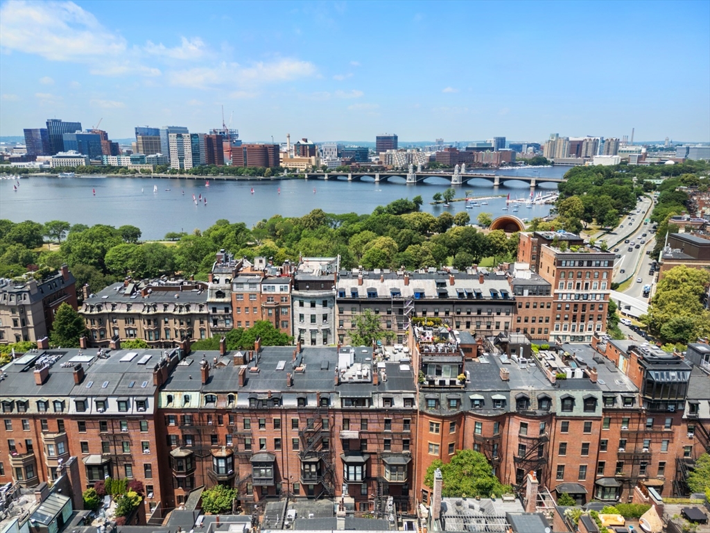 129 Beacon Street, Unit PH Boston, MA 02116 - Photo 34 of 40 a view of a city and a lake