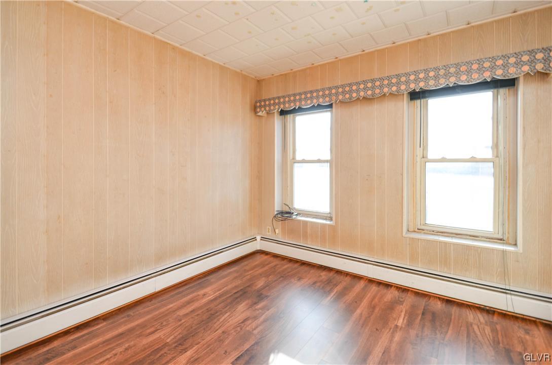 33 South 5th Street Emmaus, PA 18049 - Photo 15 of 24 an empty room with wooden floor and windows