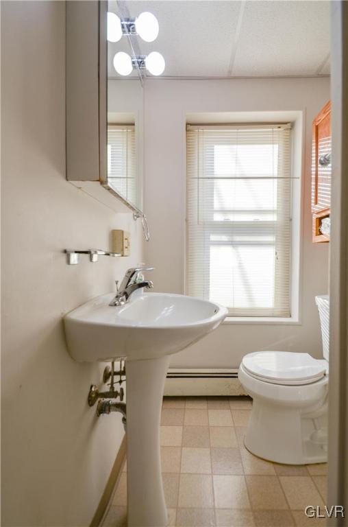 33 South 5th Street Emmaus, PA 18049 - Photo 17 of 24 a bathroom with a sink a toilet and a mirror