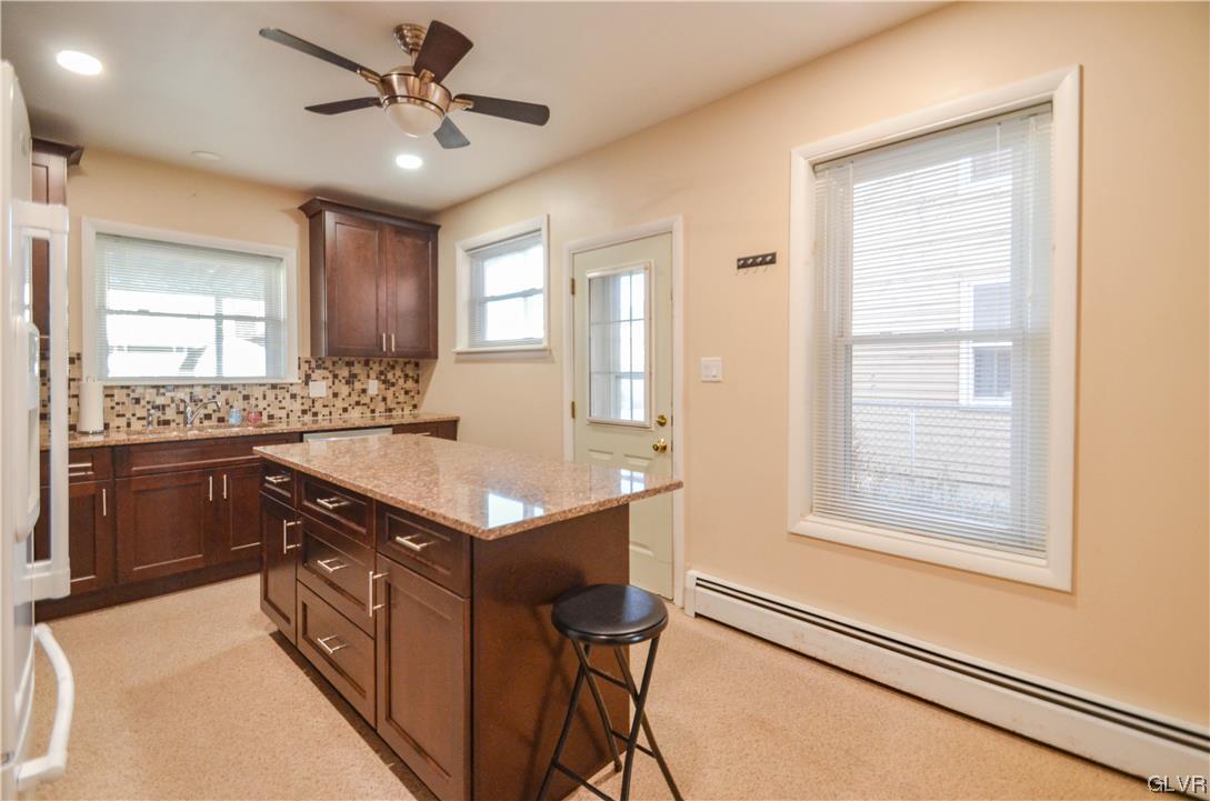 33 South 5th Street Emmaus, PA 18049 - Photo 3 of 24 a kitchen with a stove a sink and a refrigerator
