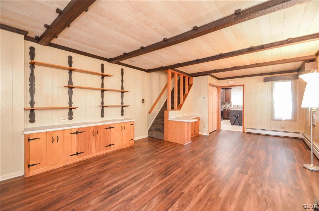 33 South 5th Street Emmaus, PA 18049 - Photo 10 of 24 a view of an empty room with wooden floor and stairs