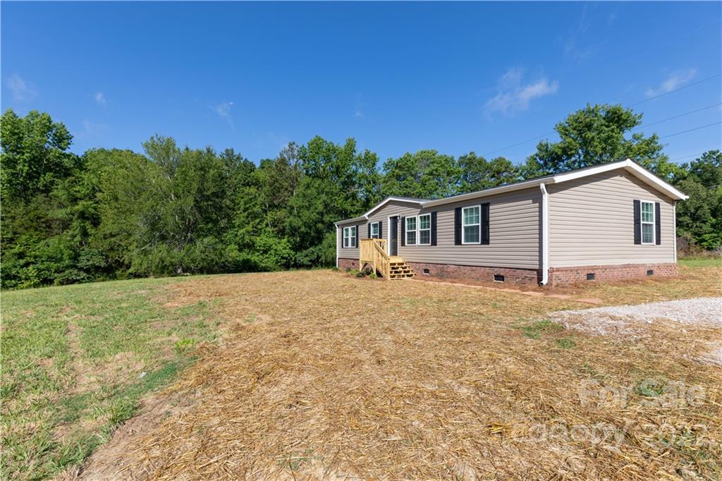 422 Pamela Road York, SC 29745 - Photo 3 of 38 a view of a house with backyard and garden