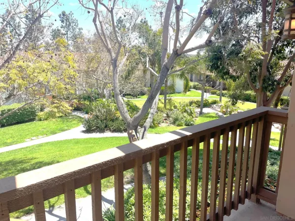 a view of outdoor space with deck and a yard