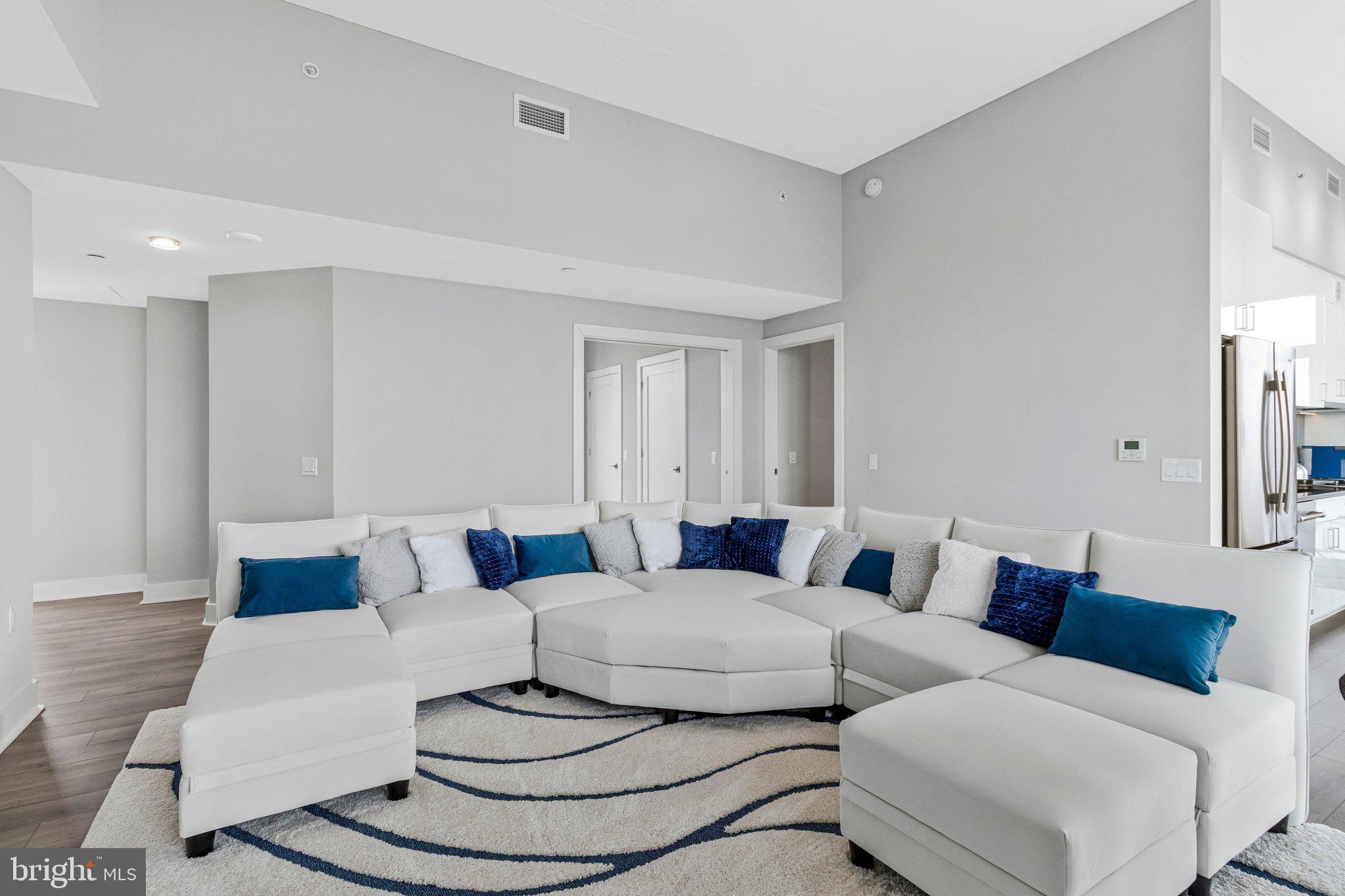 88 V Street Southwest, Unit 801 Washington, DC 20024 - Photo 12 of 58 a living room with furniture and a large mirror