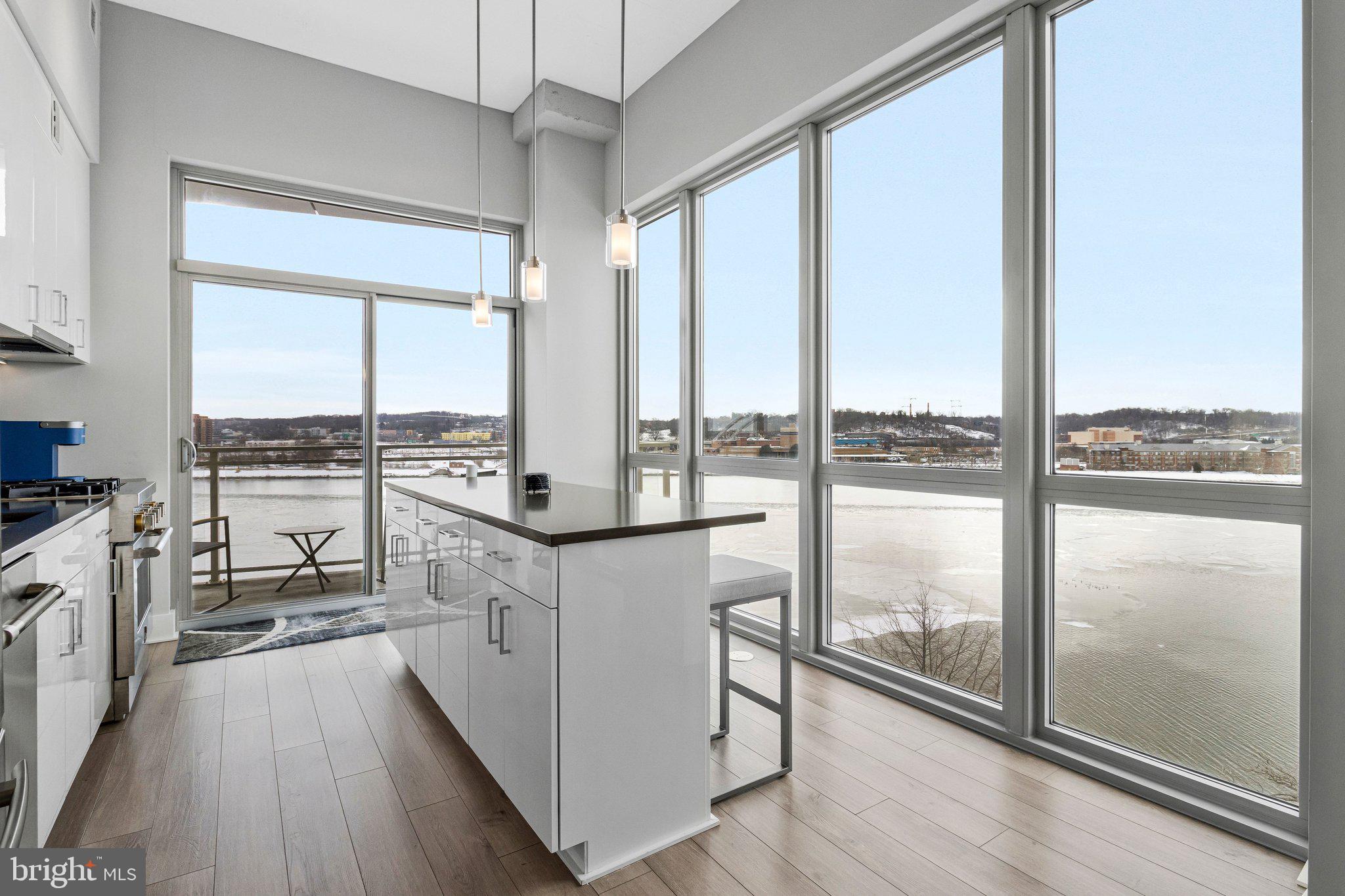88 V Street Southwest, Unit 801 Washington, DC 20024 - Photo 14 of 58 a kitchen with a large window and a view of living room