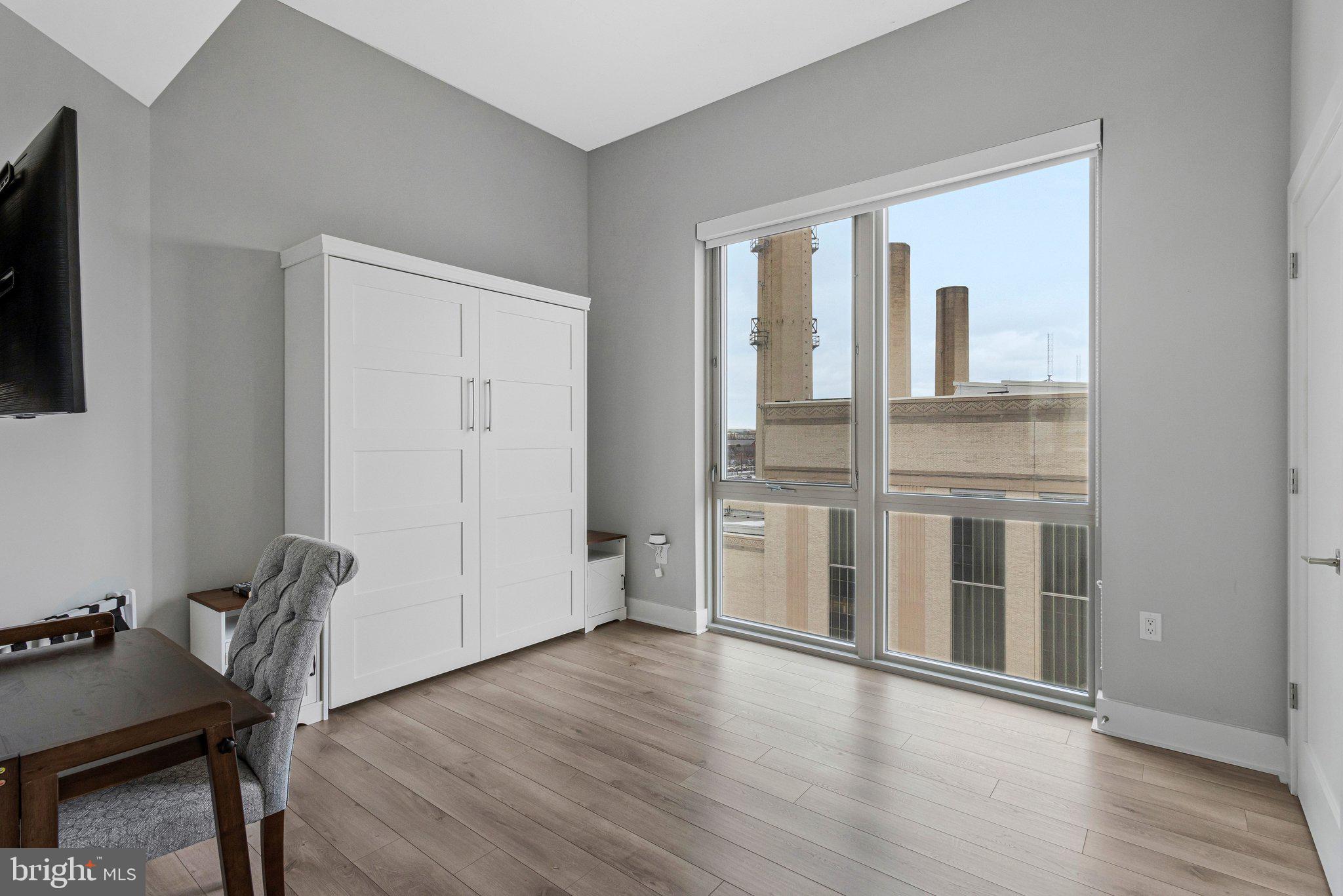 88 V Street Southwest, Unit 801 Washington, DC 20024 - Photo 19 of 58 a view of a workspace with furniture and wooden floor