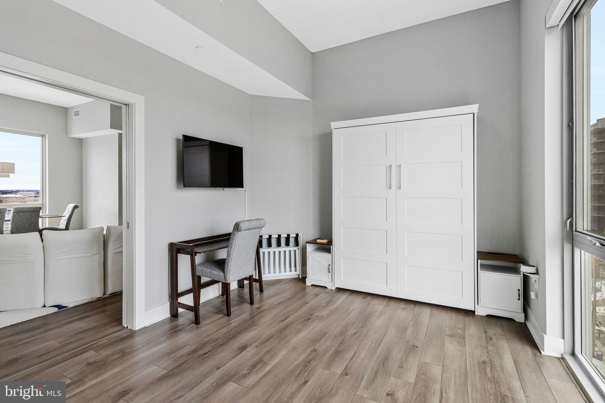 88 V Street Southwest, Unit 801 Washington, DC 20024 - Photo 20 of 58 a view of a livingroom with furniture and a flat screen tv