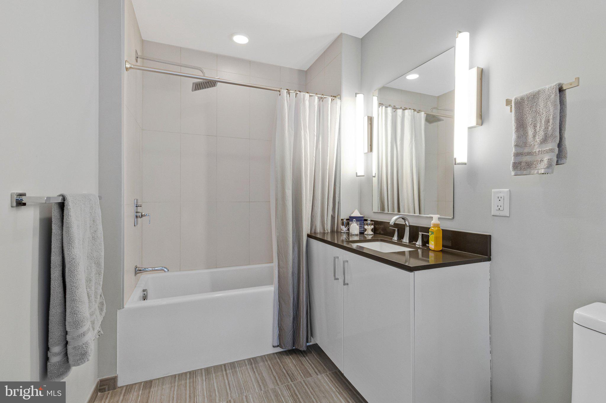 88 V Street Southwest, Unit 801 Washington, DC 20024 - Photo 22 of 58 a bathroom with a sink a toilet and shower