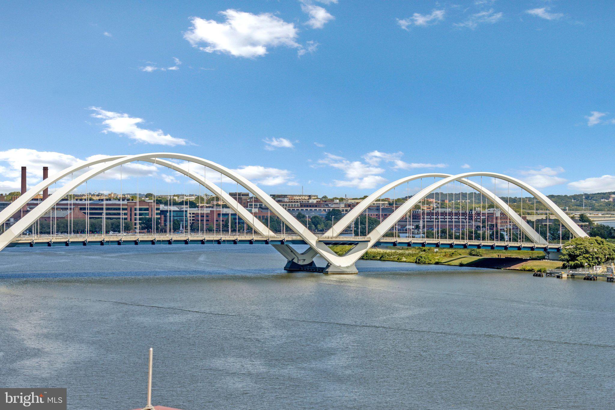 88 V Street Southwest, Unit 801 Washington, DC 20024 - Photo 3 of 58 a view of swimming pool with barbeque grill and wooden fence
