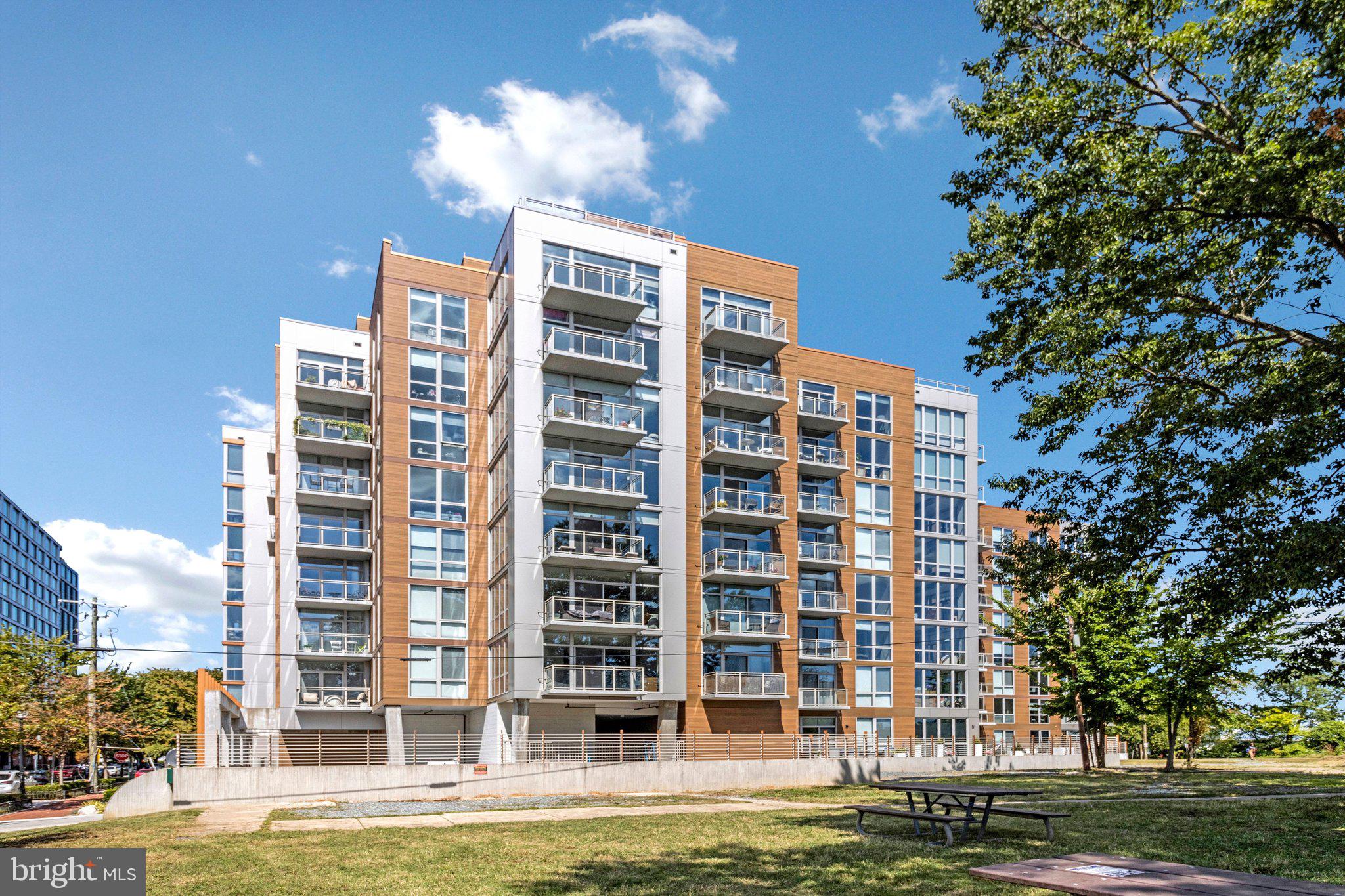 88 V Street Southwest, Unit 801 Washington, DC 20024 - Photo 39 of 58 a front view of a building with a garden