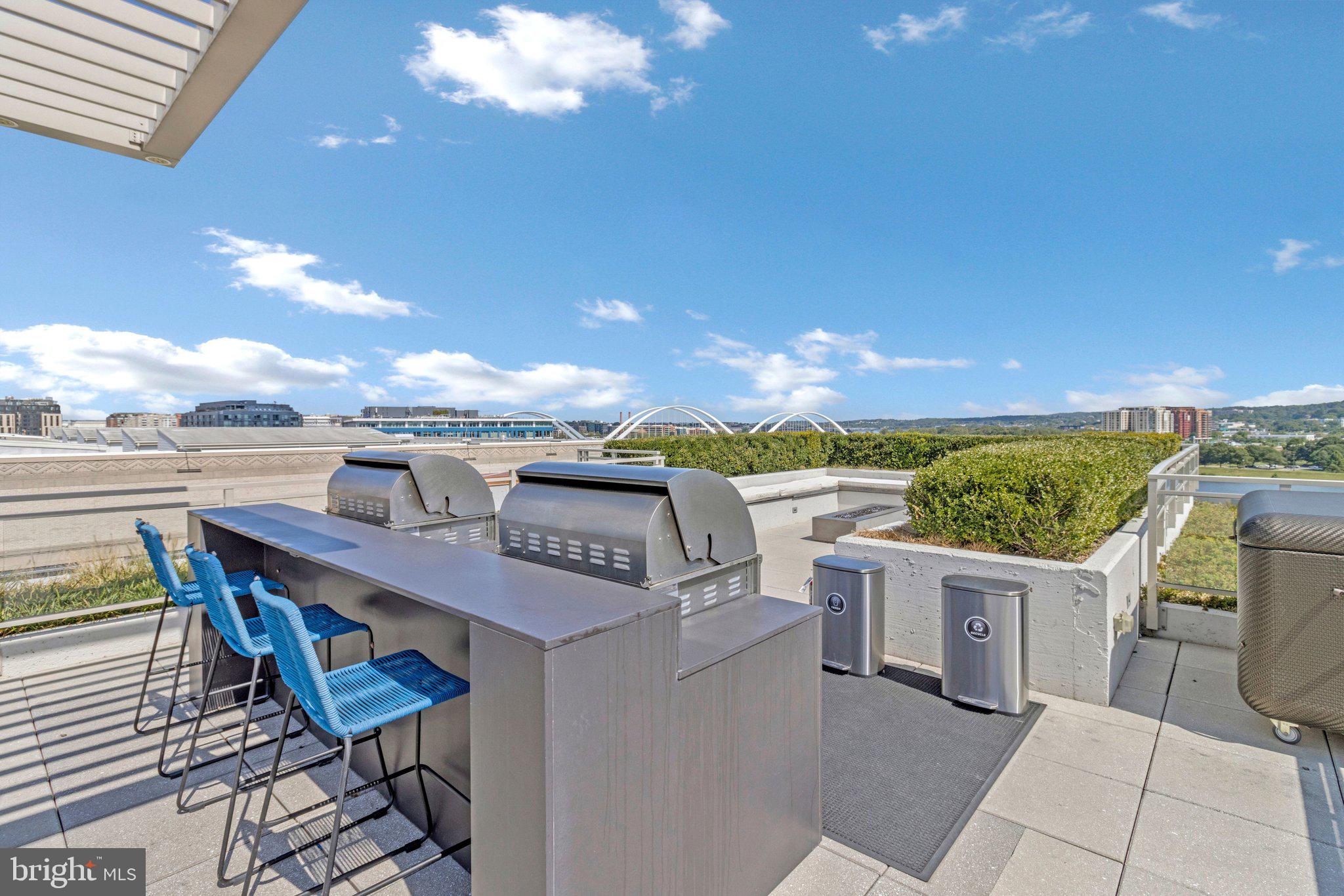 88 V Street Southwest, Unit 801 Washington, DC 20024 - Photo 51 of 58 a view of a terrace with furniture and stove