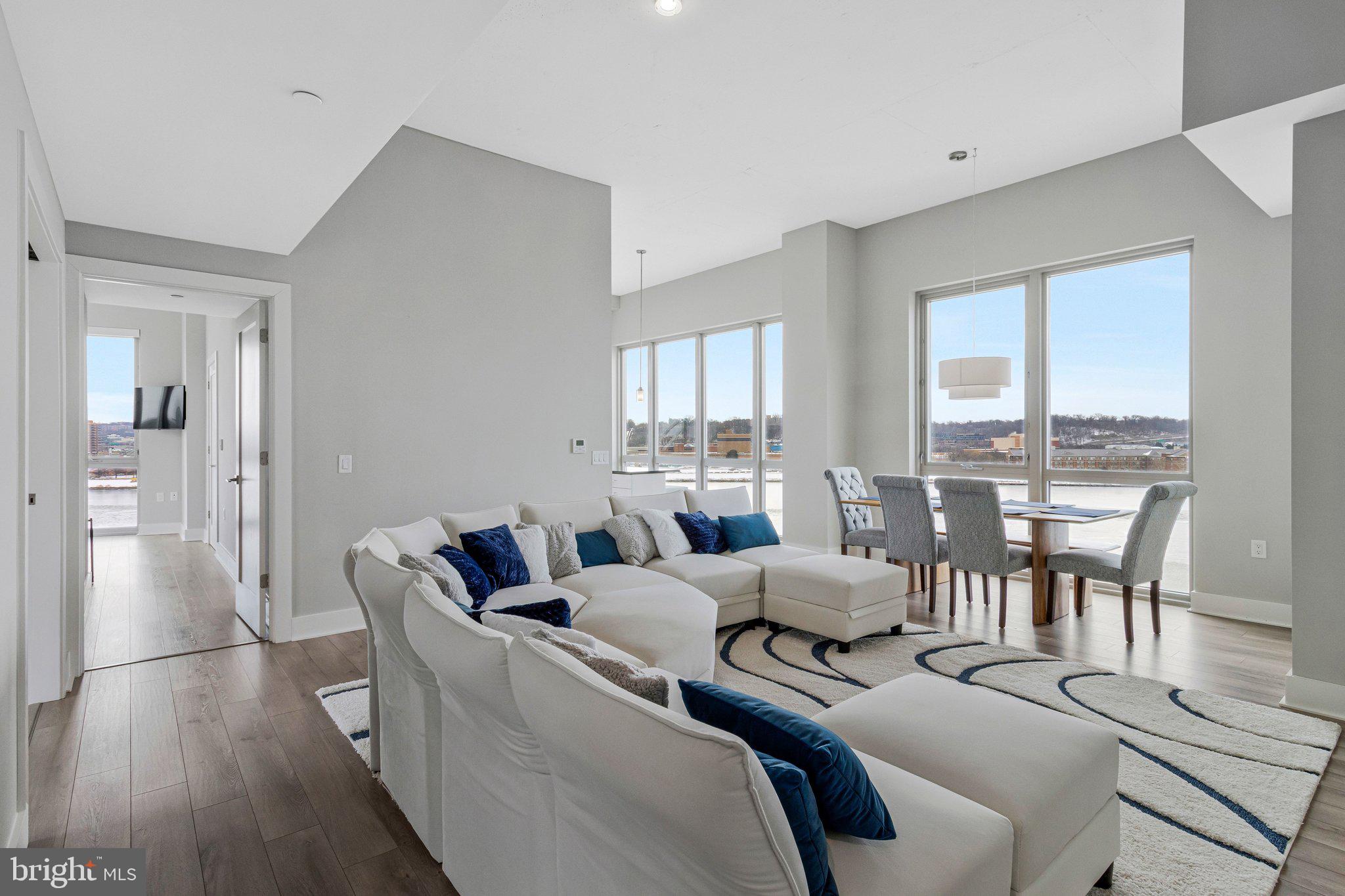 88 V Street Southwest, Unit 801 Washington, DC 20024 - Photo 8 of 58 a bedroom with furniture and a large window