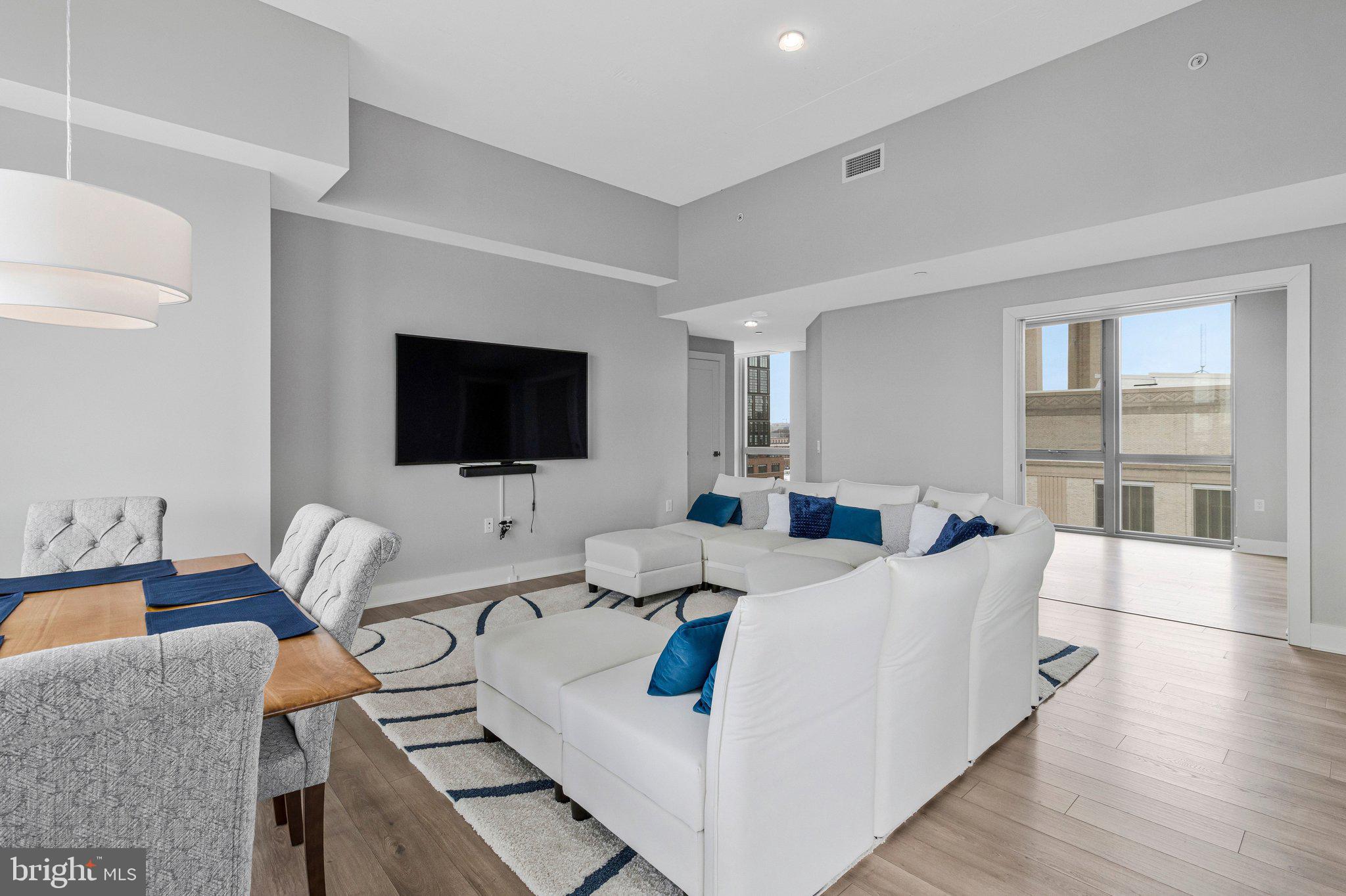 88 V Street Southwest, Unit 801 Washington, DC 20024 - Photo 10 of 58 a living room with furniture and a flat screen tv