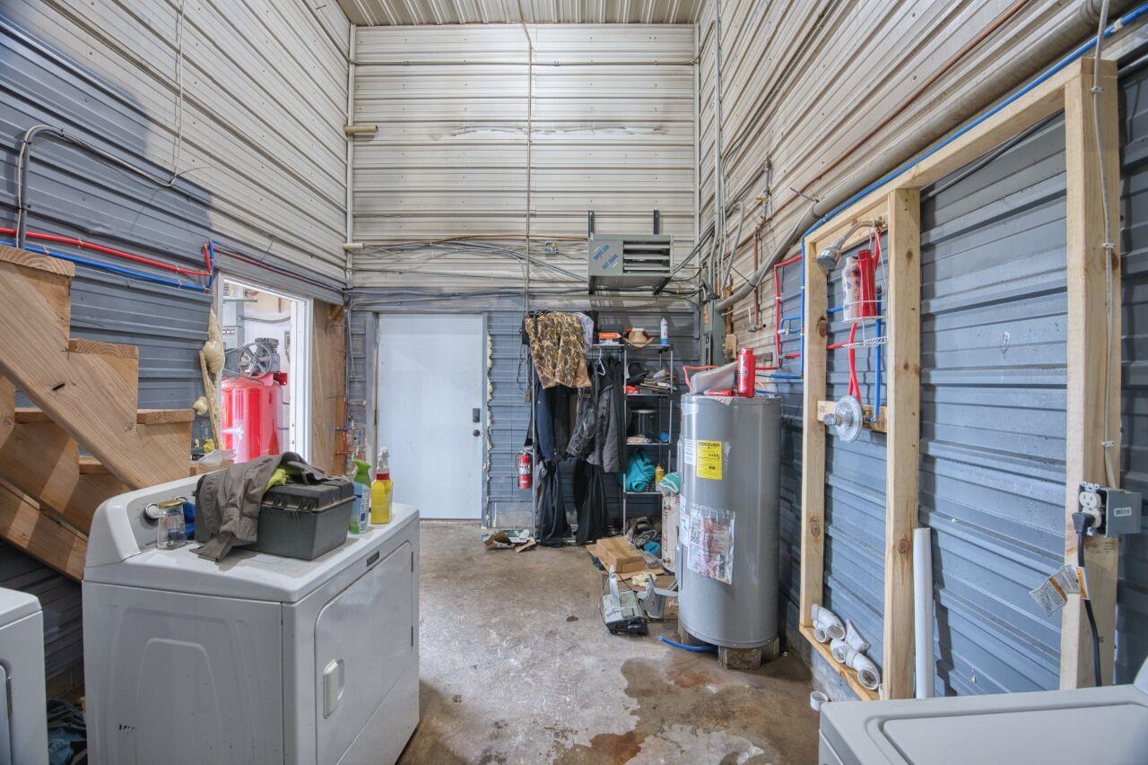 112 Highway 71 Big Falls, MN 56627 - Photo 11 of 35 Below grade area with a garage, water heater, and washing machine and dryer