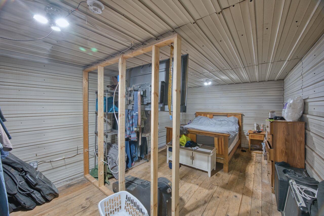 112 Highway 71 Big Falls, MN 56627 - Photo 12 of 35 Bedroom with light wood finished floors and a sauna