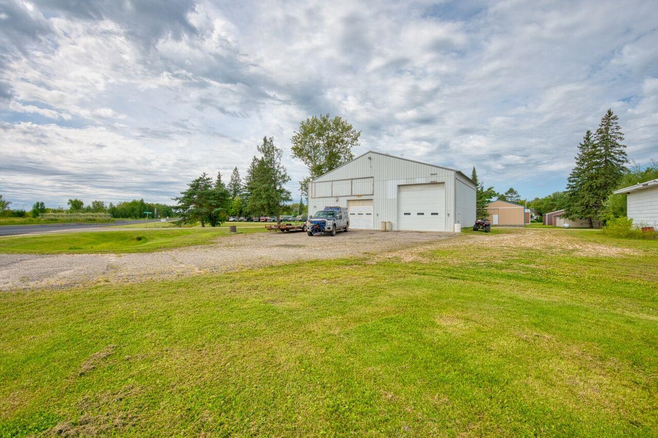 112 Highway 71 Big Falls, MN 56627 - Photo 16 of 35 View of grassy yard with an outbuilding and a garage