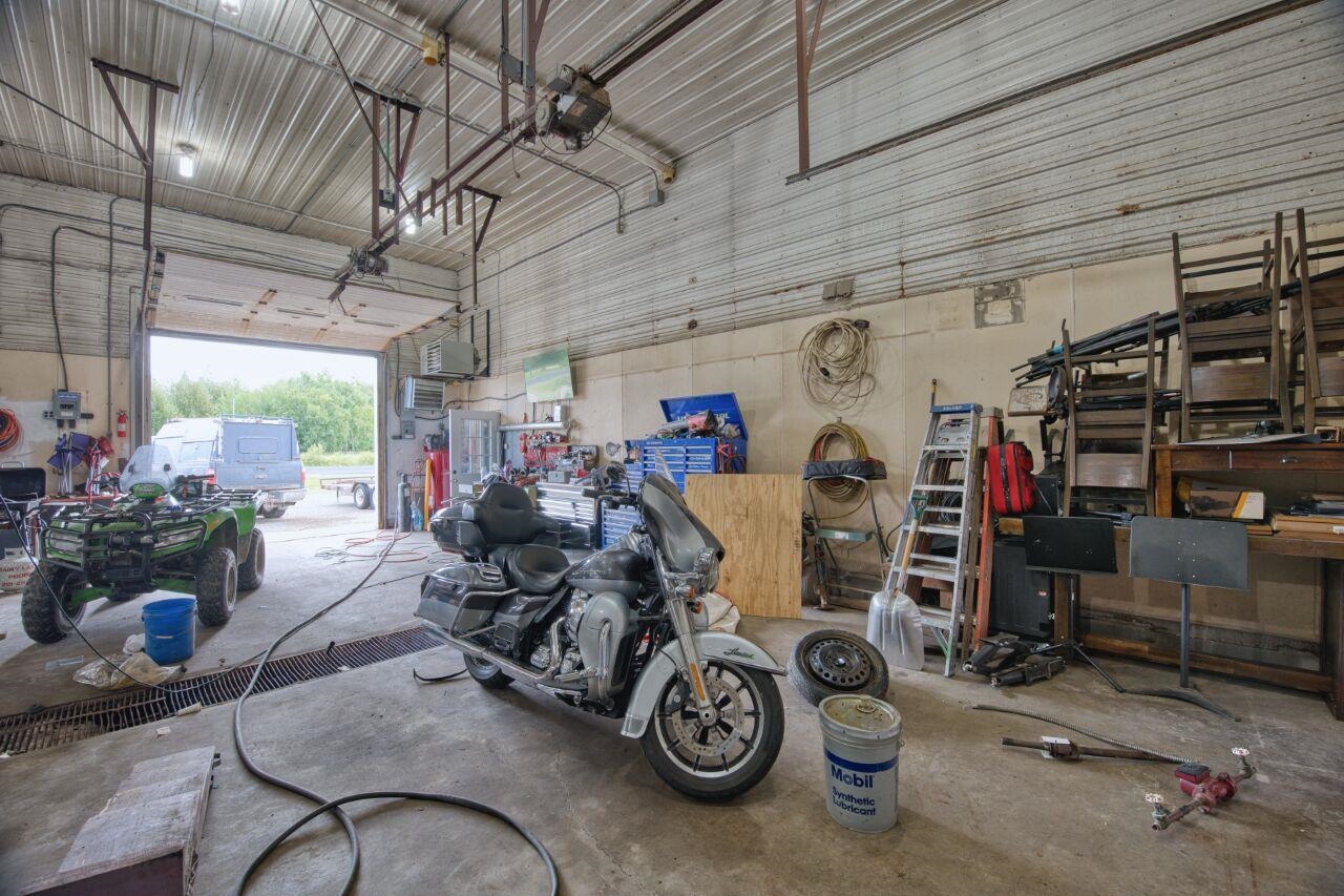 112 Highway 71 Big Falls, MN 56627 - Photo 7 of 35 Garage with metal wall and a garage door opener