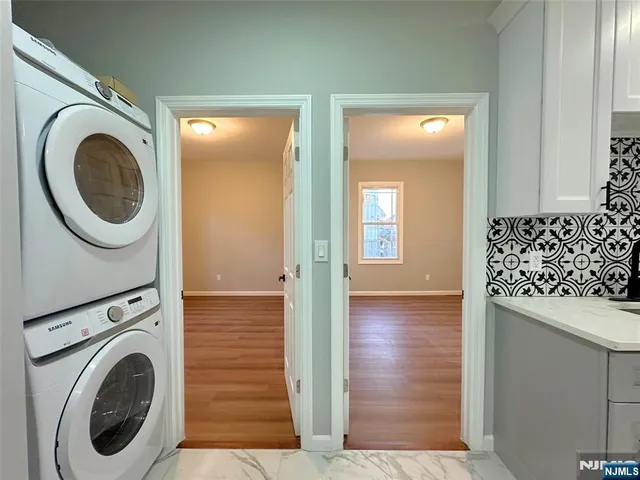 a view of a hallway with washer and dryer