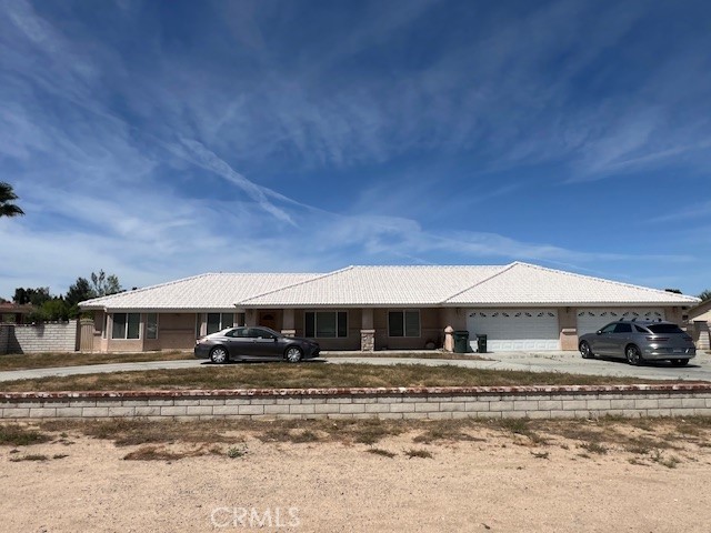 14704 Pamlico Road Apple Valley, CA 92307 - Photo 1 of 1 a front view of a house with a yard