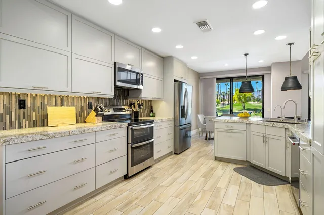 a kitchen with a sink and refrigerator