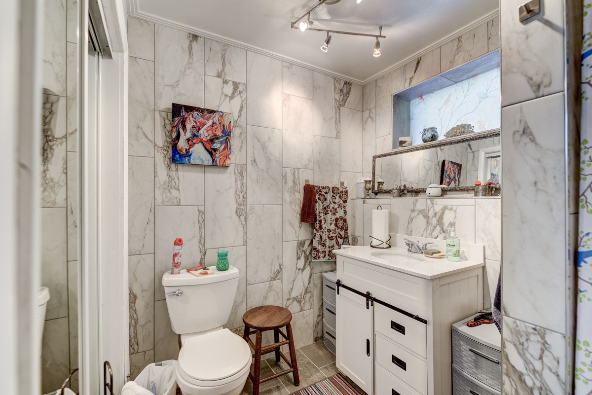 2344 Granny Wright Lane Hermitage, TN 37076 - Photo 24 of 37 a bathroom with a sink mirror vanity and toilet