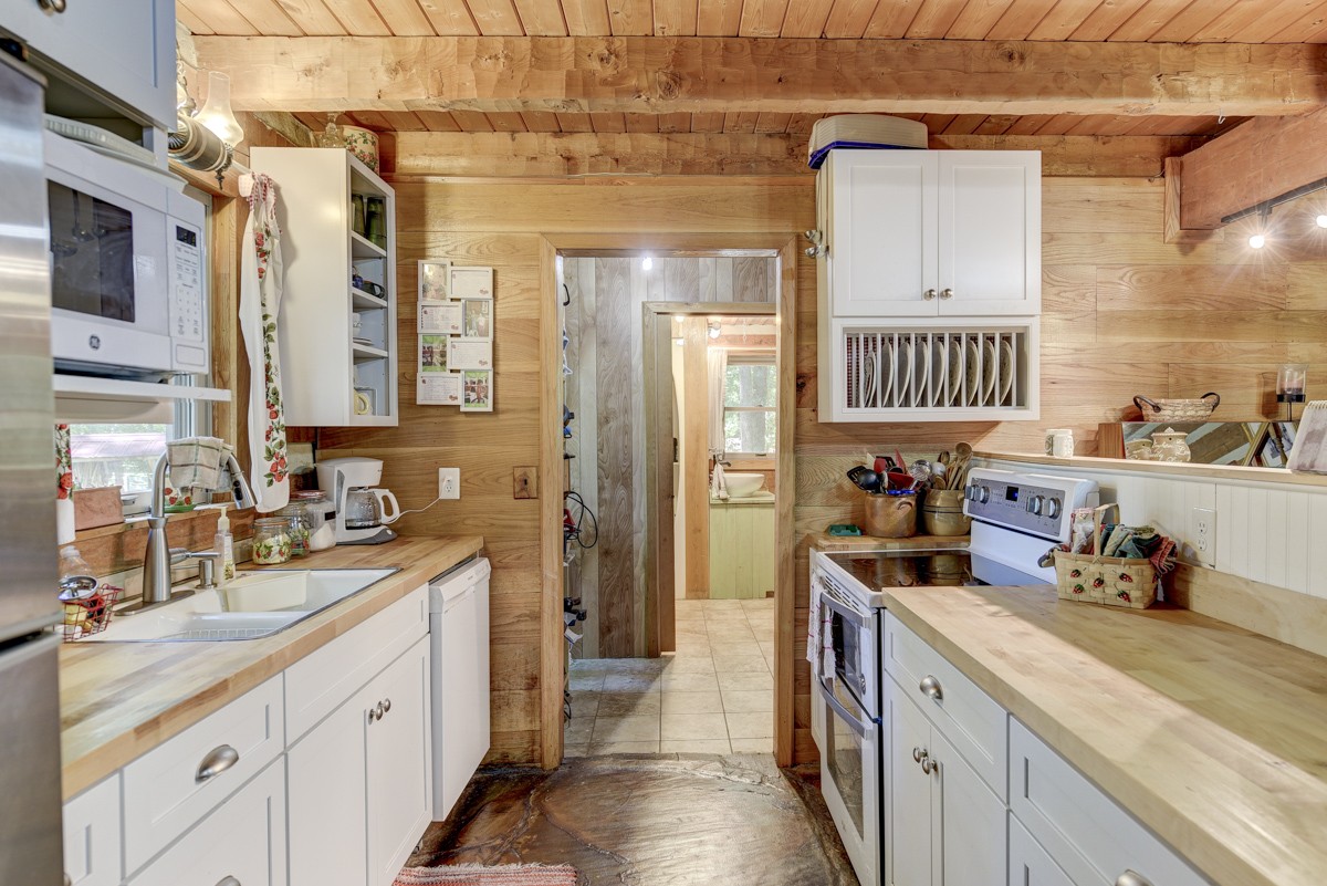 2344 Granny Wright Lane Hermitage, TN 37076 - Photo 9 of 37 a kitchen with a sink stove and cabinets