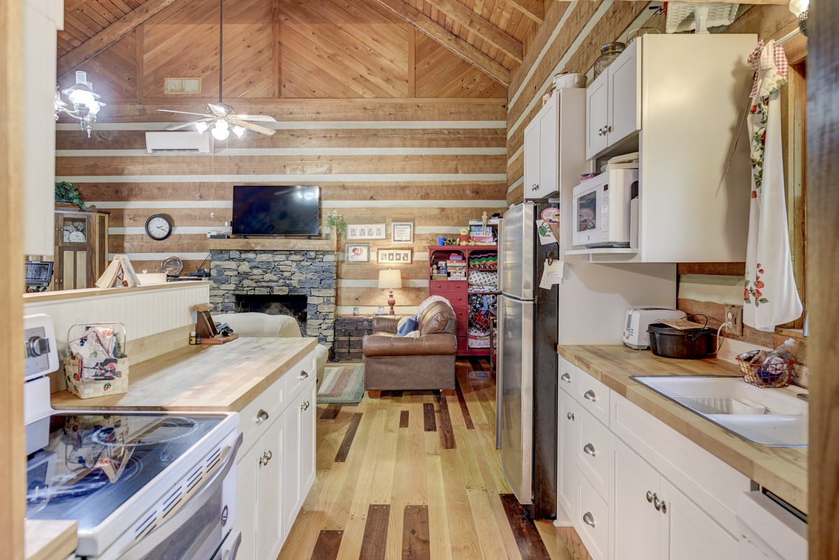 2344 Granny Wright Lane Hermitage, TN 37076 - Photo 10 of 37 a open kitchen with stainless steel appliances granite countertop a stove and a sink