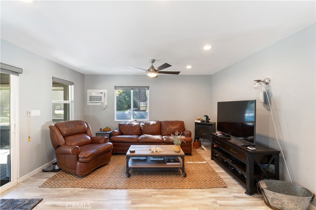 36000 Tenaja Truck Trail Fallbrook, CA 92028 - Photo 13 of 28 a living room with furniture and a flat screen tv