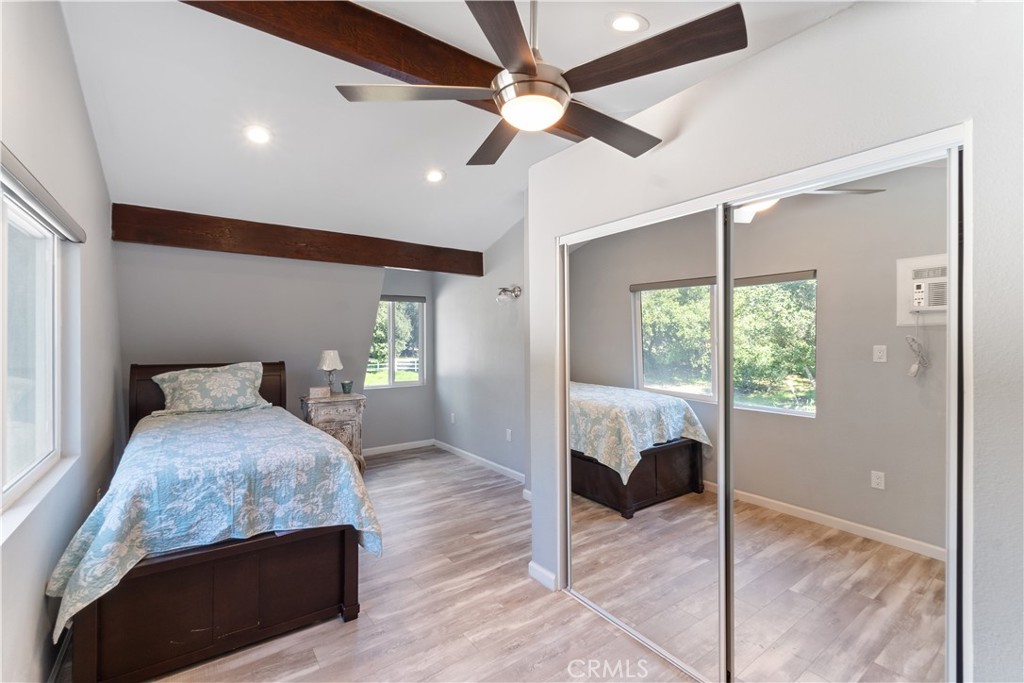 36000 Tenaja Truck Trail Fallbrook, CA 92028 - Photo 15 of 28 a bedroom with a bed and window