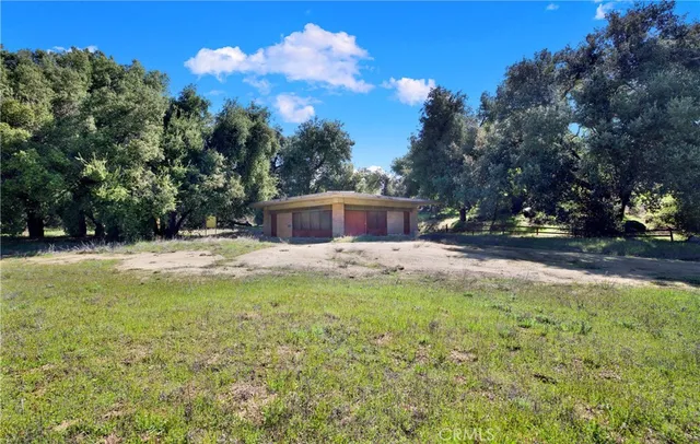 a swimming pool with outdoor seating and yard