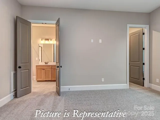 a bathroom with a sink vanity and a mirror