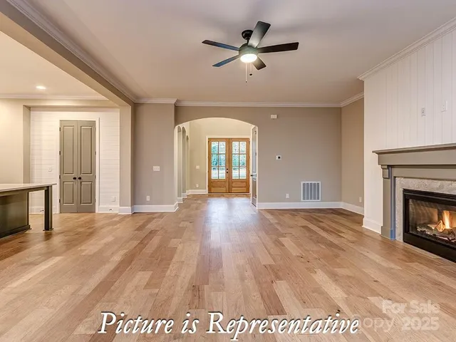 a large kitchen with kitchen island a sink a stove a refrigerator and a counter top space