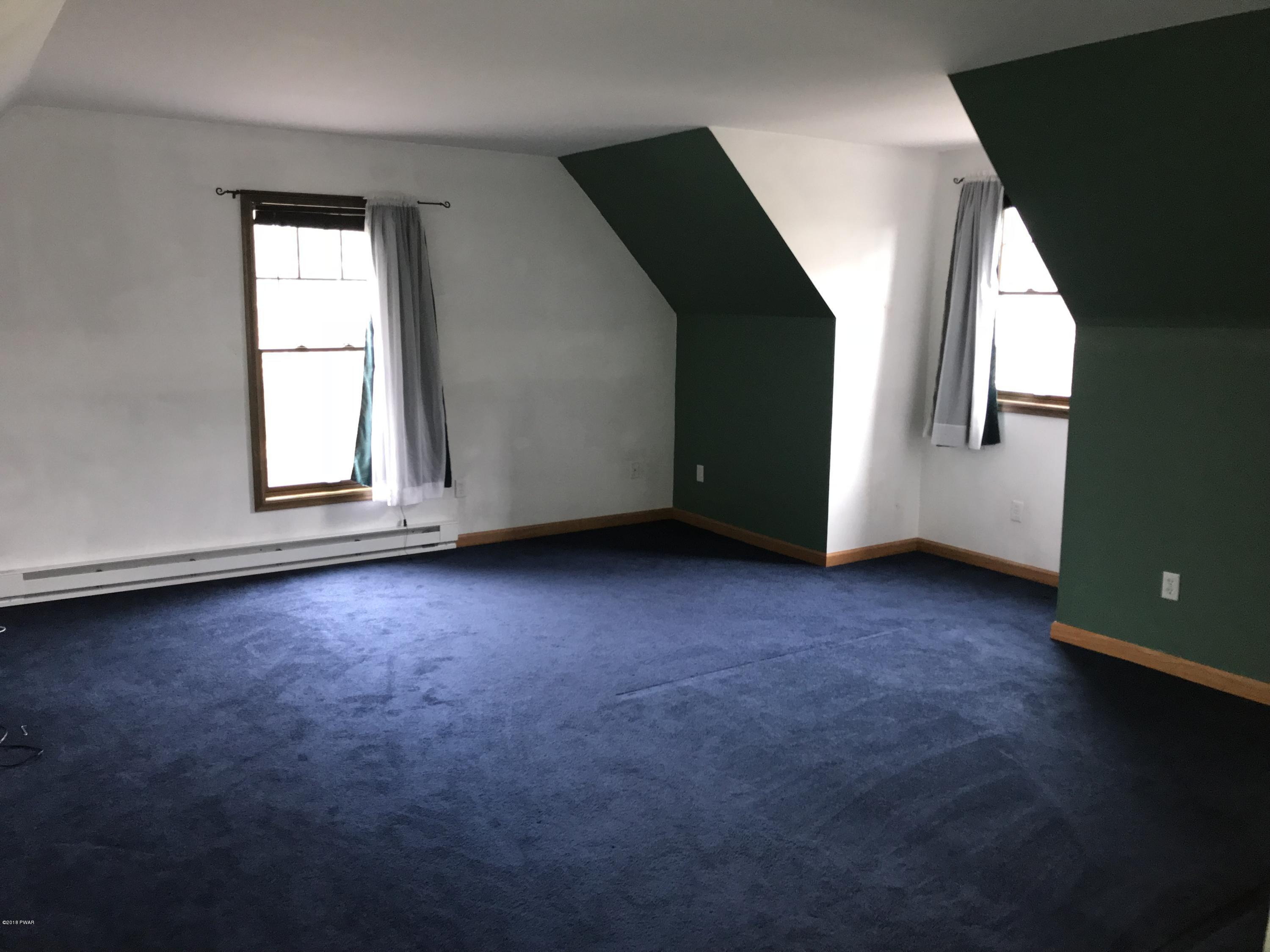 232 Maple Ridge Drive Hawley, PA 18428 - Photo 23 of 44 an empty room with windows